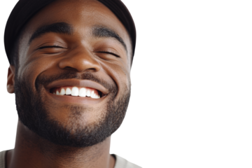 Happy man smiling brightly against a white background, showcasing joy and positivity.