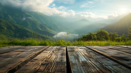 Fototapeta premium Wooden table top on blurred background of mountain meadow and sky.