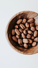 A wooden bowl filled with striped nuts, showcasing natural textures and earthy tones.