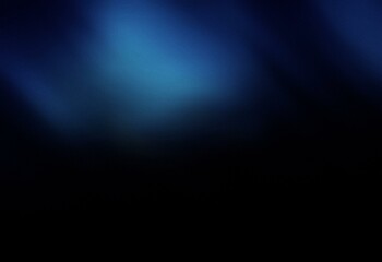 An abstract blue gradient design with grainy texture, blending into a dark, solid background.