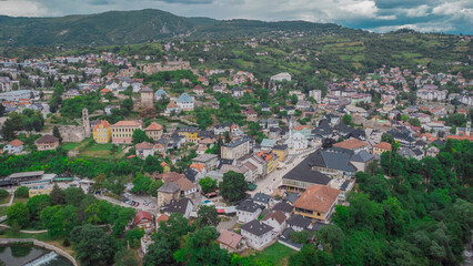 Aerial drone view of city of Jajce in Bosnia and hercegovina, known for its birthplace of Jugoslavia. Visible main square and surrounding hills