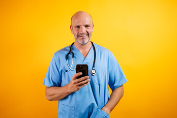 A friendly doctor in a white coat is holding a smartphone, suggesting modern healthcare and communication.