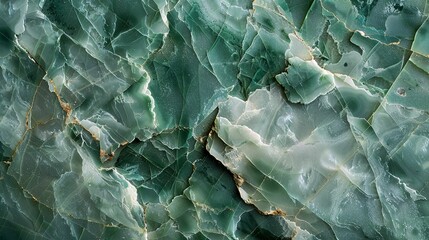 A close-up view of a green and gold marble stone with intricate patterns.