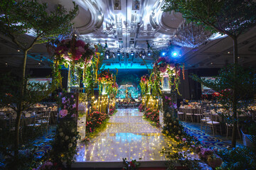 luxury color theme wedding solemnisation dinner flower florist , dinnerware banquet, cloth and stage lighting decoration design in premium hotel ballroom and beautiful beach event