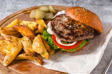 burger with Tomatoes and Pickles with French Fries and Ketchup