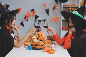 friendship, holiday and people concept - group of happy smiling friends in halloween costumes of...