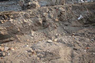 Construction Site Groundwork with Exposed Earth Rocks, and Rubble, Excavation Scene for Urban Development, Infrastructure Projects, or Building Foundations with Rough Textures and Soil Layers