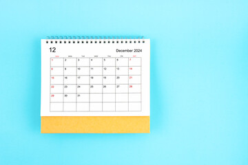 December 2024, Monthly desk calendar for 2024 year on blue background.