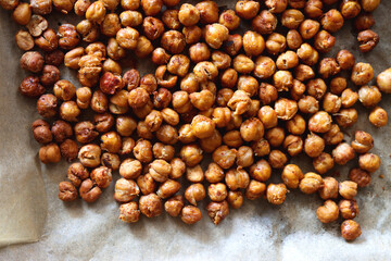 Sheet pan with homemade roasted chickpeas. Top view.