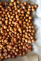 Sheet pan with homemade roasted chickpeas. Top view.