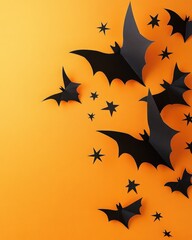 Halloween decoration with paper cut bats stars and crosses on orange background