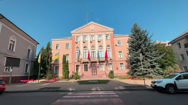 Ternopil Western Ukraine . City Hall and national flags on the building. Yellow-blue flag and red-black.