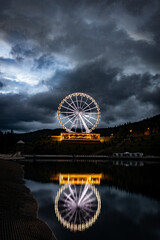 Night landscape, Ferris wheel with beautiful illumination at night. Attraction in Bukovel.