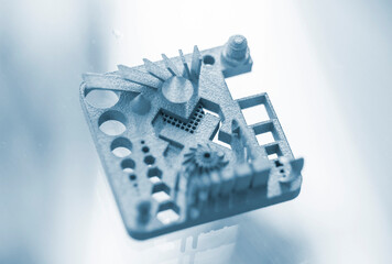 Object printed on 3D printer from metal powder using Metal Jet technology. High detailed detailing parts. Metal Jet. 3D-printed metal parts. Modern 3D printing, additive manufacturing technologies
