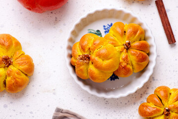 Pumpkin-shaped buns with apple and pumpkin filling.