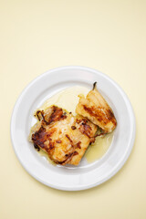 fried cod fish with olive oil on white dish