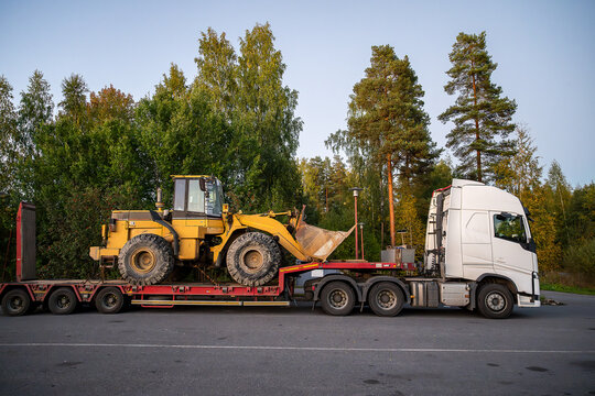 Heavy-Duty truck transporting agricultural farm tractor 