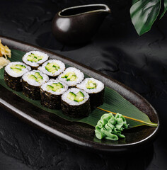 Elegant sushi platter presentation on dark background