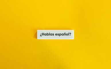 ¿Hablas español? Text on Block Letter Tile on Yellow Background. Minimal Aesthetic.