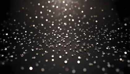 Obraz premium Shimmering silver sparkles on a dark background