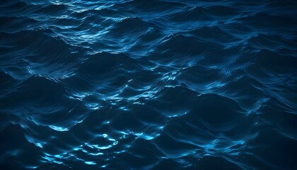 Obraz premium Rippling blue water surface with glowing moonlight , creating a dynamic and abstract pattern
