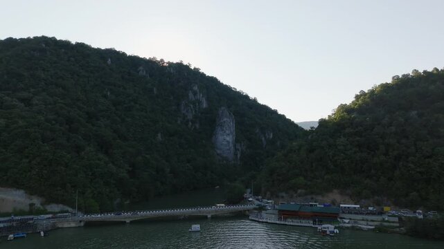 4K Romania Rock Sculpture of Decebalus slow tracking shot with sun flare