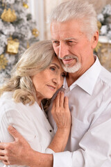 couple old and mature seniors enjoying and having fun together celebrating the new year 