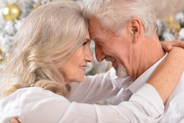 couple old and mature seniors enjoying and having fun together celebrating the new year 