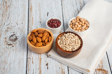 Mung beans, Red kidney beans, Chickpeas source and peeled barley in a basket wooden isolated on wood background