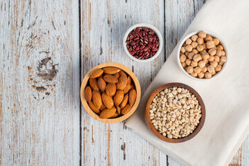 Mung beans, Red kidney beans, Chickpeas source and peeled barley in a basket wooden isolated on wood background