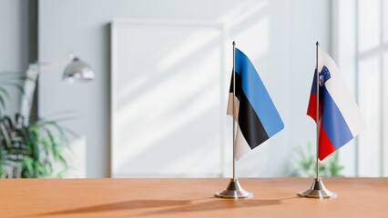 FLAGS OF ESTONIA AND SLOVENIA ON TABLE