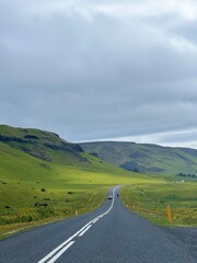 Journey through Iceland's vibrant green landscapes, where every bend reveals nature's enchanting beauty.