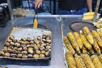 Roasted street chestnuts and corn at a street stall. selling fried corn and chestnut outdoor in Istanbul, Turkey