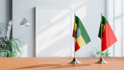 FLAGS OF ETHIOPIA AND PORTUGAL ON TABLE