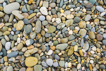 closeup varicoloured heap of marine pebbles as a background