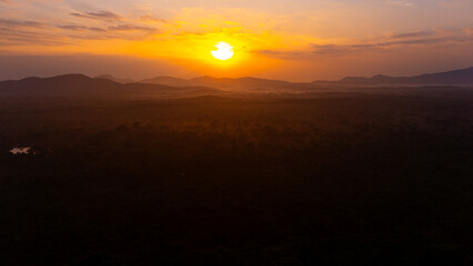 Breathtaking Sri Lankan sunset. A breathtaking sunset illuminates the mountains and valleys of Sri Lanka, casting a warm glow over the landscape as daylight fades.