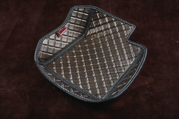 luxury quality titanium galaxy car matt pvc leather shining gloss carpet in red brown black grey blue green maroon color texture round shape on dark brown carpet background