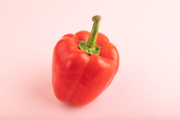 Red pepper on pink pastel, Side view, copy space.