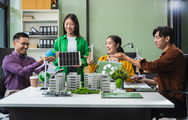 Businessman team brainstorming using tablet, laptop computer for working technology and business, Renewable energy-based green businesses and global warming. Reduce CO2 emission.