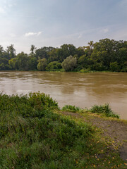 Mudflow of water in the Oder River of brown color. Poland. View from above. Background.