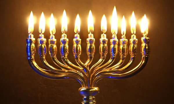 A lit menorah with nine candles glowing warmly in a dark setting.
