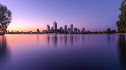 Obraz premium Perth City Skyline Reflected in Still Water at Sunset