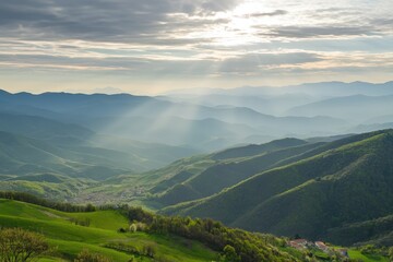 Fototapeta premium Breathtaking mountain vistas illuminated by gentle sunlight in a serene valley setting