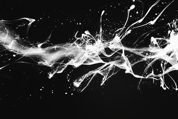 Dynamic white splashes create a striking abstract pattern against a deep black background