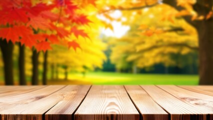 Empty wood table top and blurred autumn tree and red leaf background - can used for display or montage your products