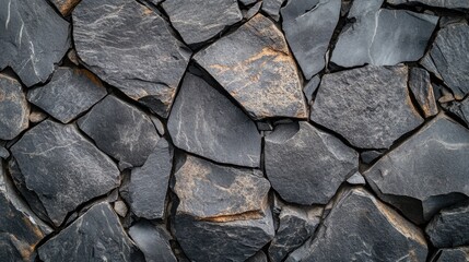 Fototapeta premium Grey stone and rock texture, featuring a mix of rough and polished surfaces, perfect for creating an abstract background with natural elegance
