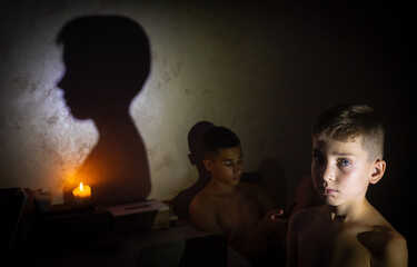 Two teenagers in a city flat during a blackout