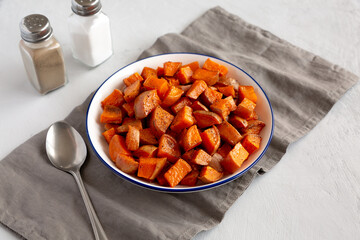 Homemade Roasted Sweet Potatoes on a Plate, side view.