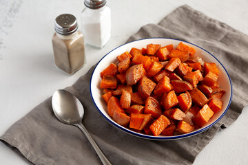 Homemade Roasted Sweet Potatoes on a Plate, side view.