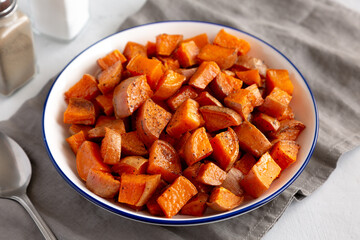 Homemade Roasted Sweet Potatoes on a Plate, side view.